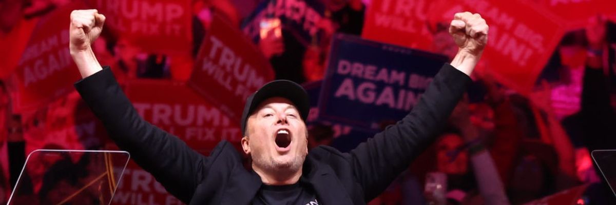 Elon Musk with fists raised during Trump rally