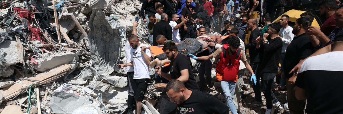 Emergency workers search rubble after Israeli attack in West Bank