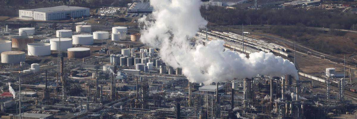 Emissions are seen from a smoke stack at the Phillips 66 Refinery