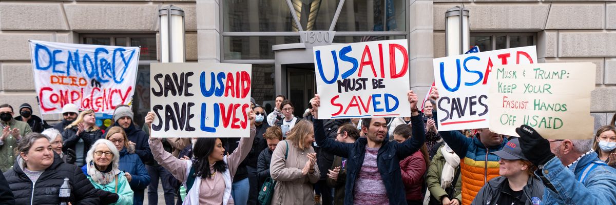 Employees and supporters protest outside the headquarters for United States Agency for International Development