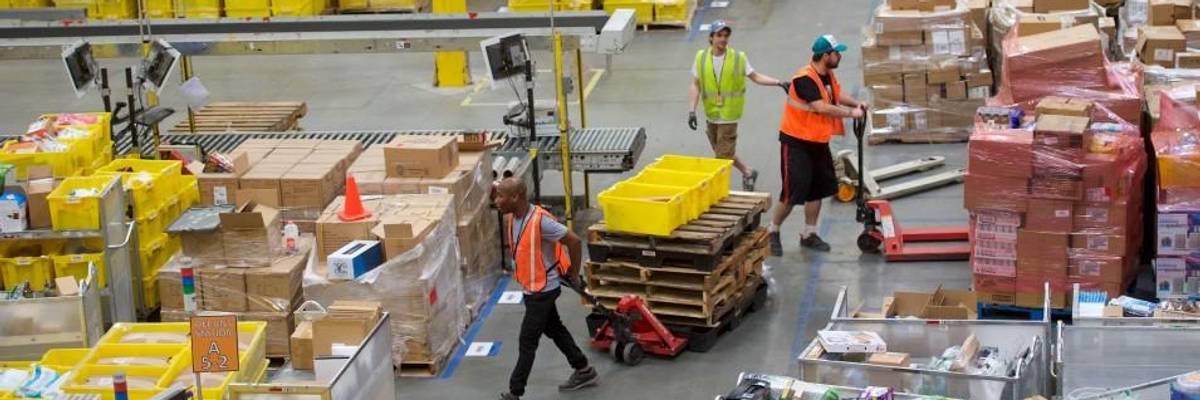 Employees in Amazon warehouse.
