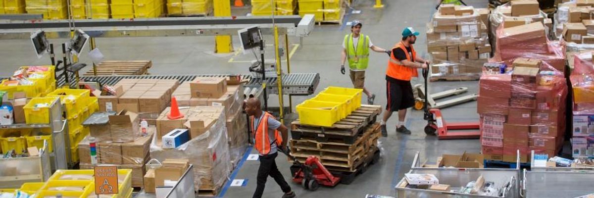 Employees in Amazon warehouse.