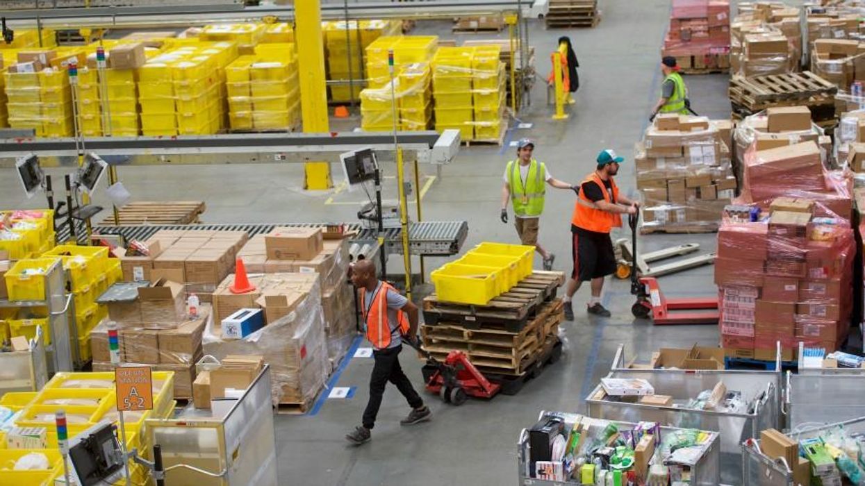 Employees in Amazon warehouse.