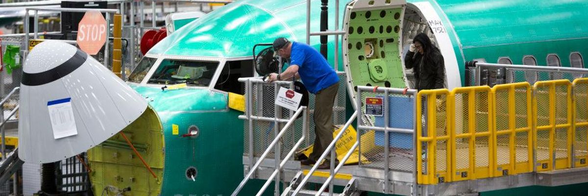 Employees work on Boeing 737 Max airplanes at a factory in Renton, Washington on March 27, 2019.