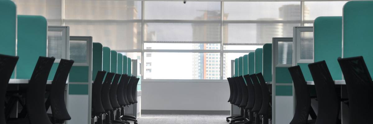 Empty chairs and cubicles.