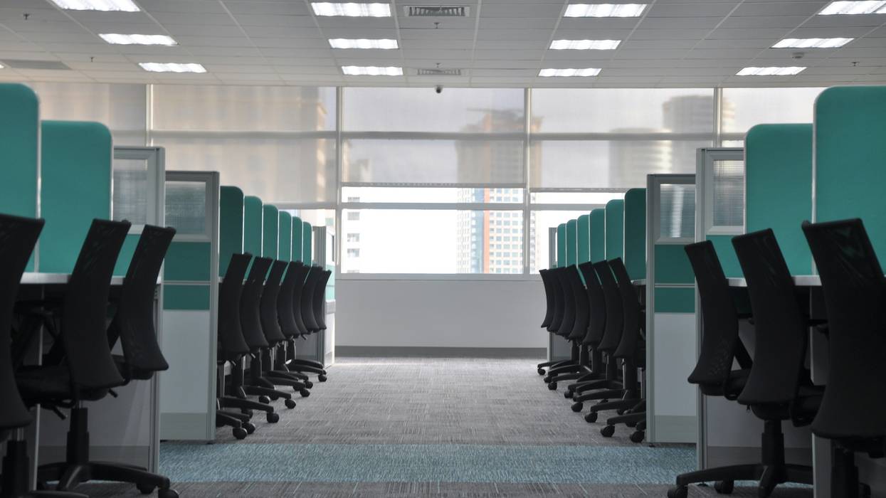 Empty chairs and cubicles.