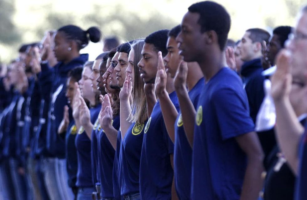 Enlistees to all branches of the U.S. military take their oaths at a Veteran's Day celebration in Dallas in 2012. (Photo:AP/LM Otero)
