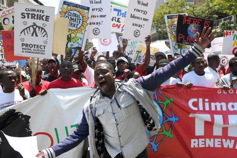 Environmental activists march carrying placards as they take part in a protest calling for action on climate change, in Nairobi on September 20, 2019. (Photo: Simon Maina/AFP/Getty Images)