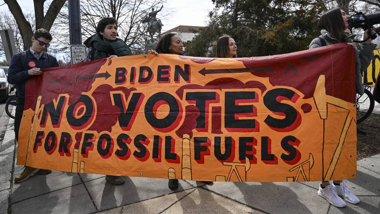 Environmental activists protest against the Willow oil project in Alaska's North Slope region as U.S. President Joe Biden attends a conservation summit at the Interior Department in Washington, D.C. on March 21, 2023.