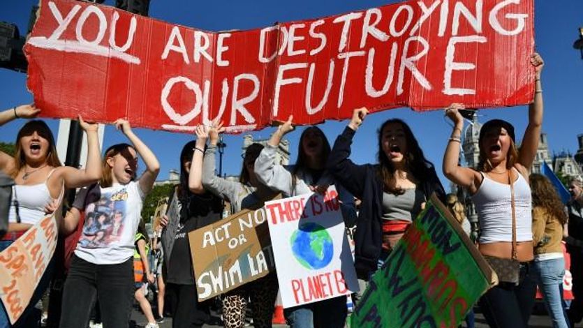 Environmental activists rally during the UK Student Climate Network's Global Climate Strike protest action in central London, on September 20, 2019. - Millions of people are taking to the streets across the world in what could be the largest climate protest in history. (Photo: Ben STANSALL/AFP/Getty Images)