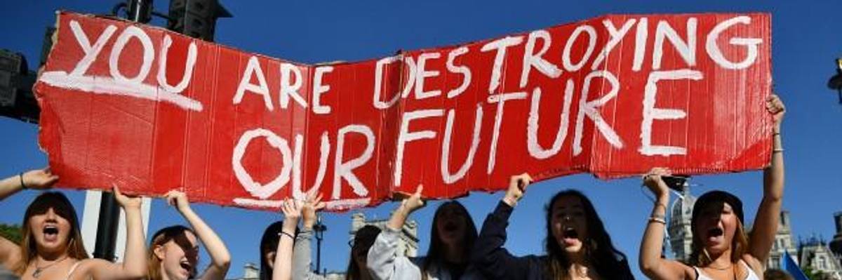 Environmental activists rally during the UK Student Climate Network's Global Climate Strike protest action in central London, on September 20, 2019. - Millions of people are taking to the streets across the world in what could be the largest climate protest in history. (Photo: Ben STANSALL/AFP/Getty Images)