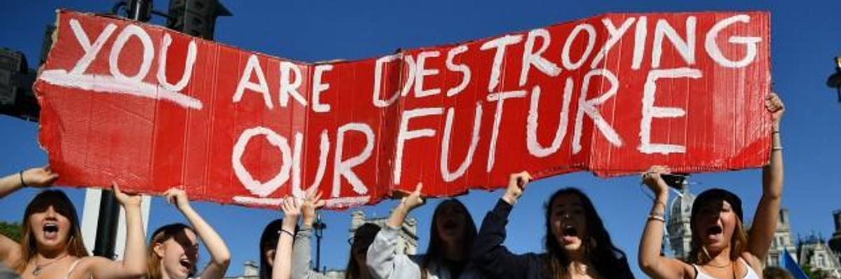 Environmental activists rally during the UK Student Climate Network's Global Climate Strike protest action in central London, on September 20, 2019. - Millions of people are taking to the streets across the world in what could be the largest climate protest in history. (Photo: Ben STANSALL/AFP/Getty Images)