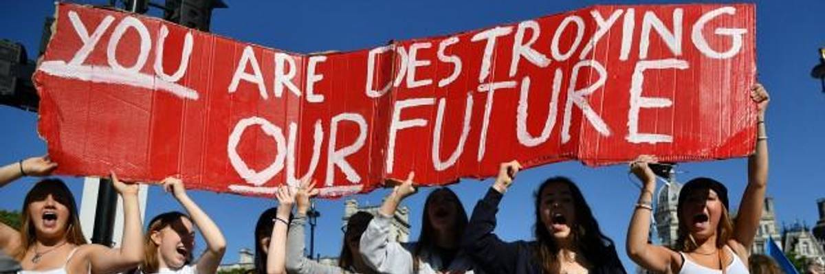 Environmental activists rally during the UK Student Climate Network's Global Climate Strike protest action in central London, on September 20, 2019. - Millions of people are taking to the streets across the world in what could be the largest climate protest in history. (Photo: Ben STANSALL/AFP/Getty Images)