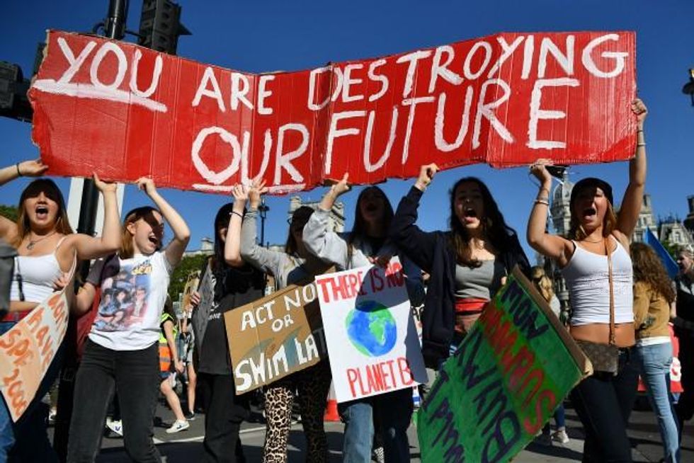 Environmental activists rally during the UK Student Climate Network's Global Climate Strike protest action in central London, on September 20, 2019. - Millions of people are taking to the streets across the world in what could be the largest climate protest in history. (Photo: Ben STANSALL/AFP/Getty Images)