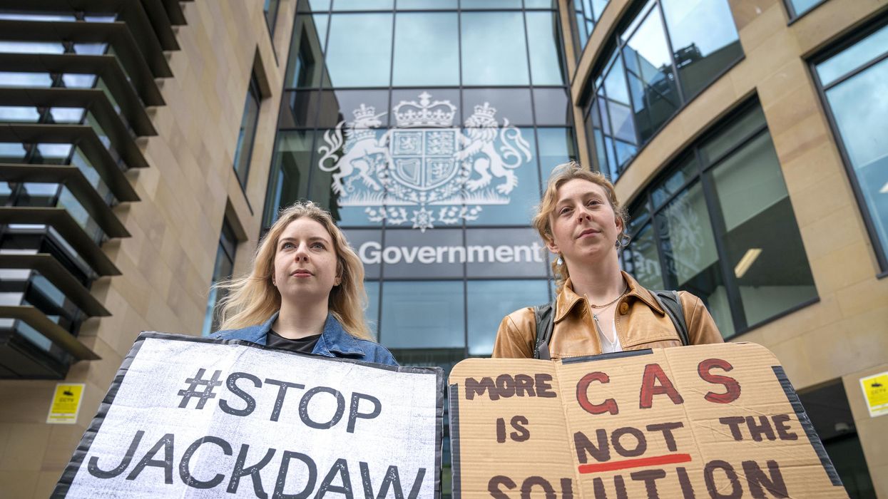 Environmental campaigners from Friends of the Earth protest outside the U.K. government building in Edinburgh to demand the U.K. government reverse its decision to approve Shell's Jackdaw gas field in the North Sea and instead move away from fossil fuels, on June 2, 2022. (Photo: Jane Barlow/PA Images via Getty Images)