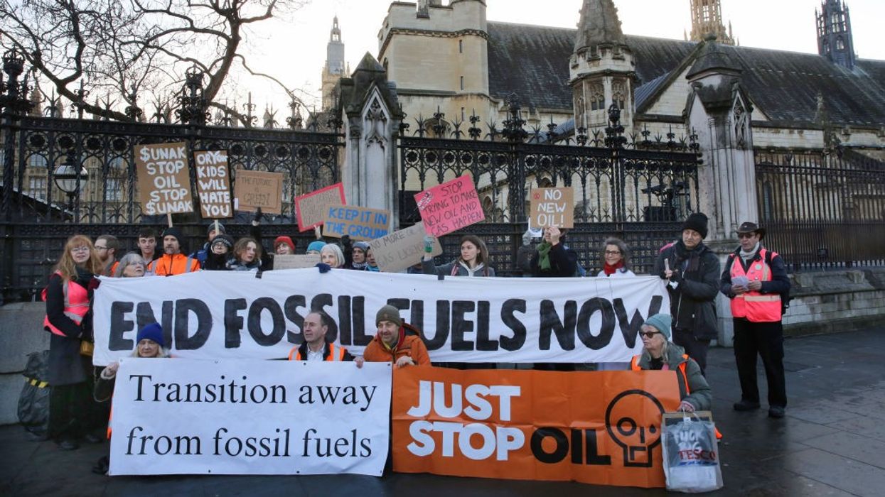 environmental protesters gathering with placards
