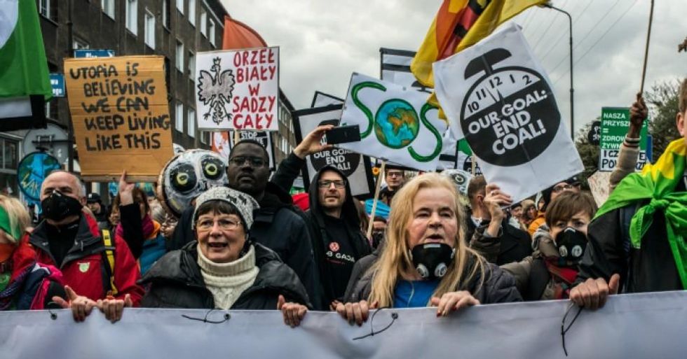 Environmental protesters take part in a Greenpeace-organized march to call for the political and economic reforms needed to combat climate change while the COP24 summit takes place in Katowice, Poland. (Photo: Martyn Aim/Getty Images)