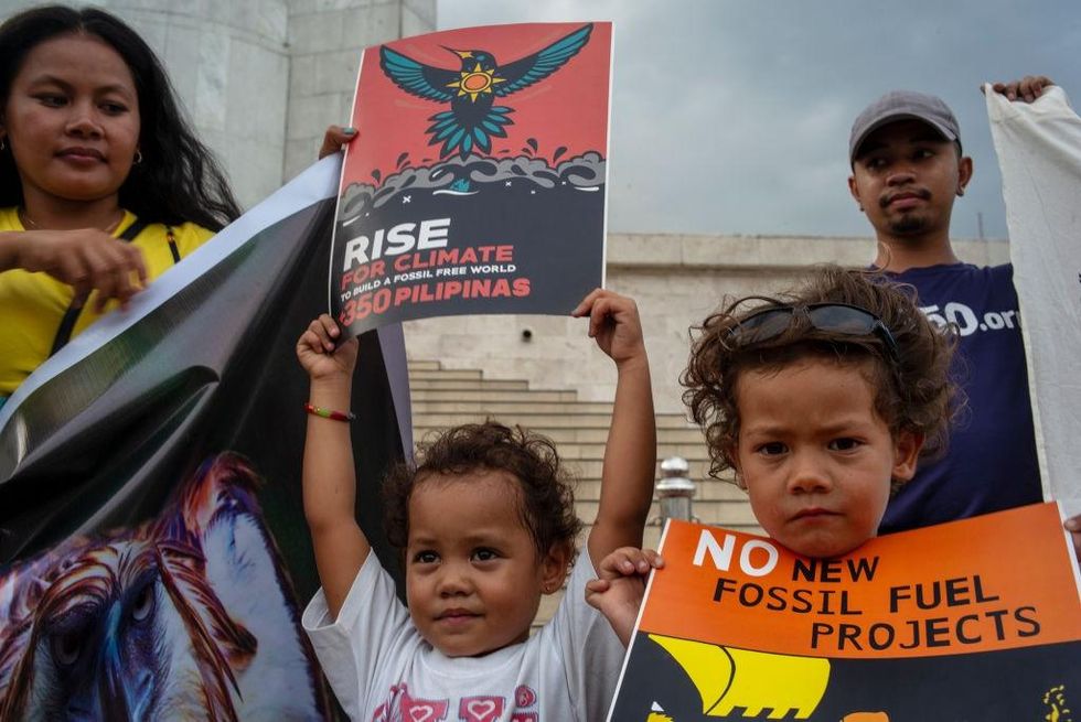 Environmentalists and concerned citizens gather and hold a picket to voice out concern on environmental and climate issues on March 15, 2019 in Quezon city, Philippines. Students around the world took to the streets on March 15 to protest a lack of climate awareness and demand that elected officials take action on climate change. Inspired by Greta Thunberg, the 16-year-old environmental activist who started skipping school since August 2018 to protest outside Sweden's parliament, school and university students worldwide have followed her lead and shared her alarm and anger. (Photo by Jes Aznar/Getty Images)