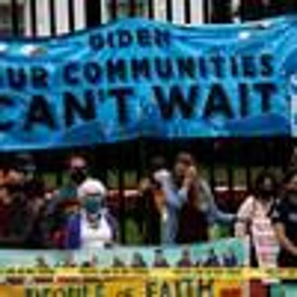 Environmentalists protest outside the White House