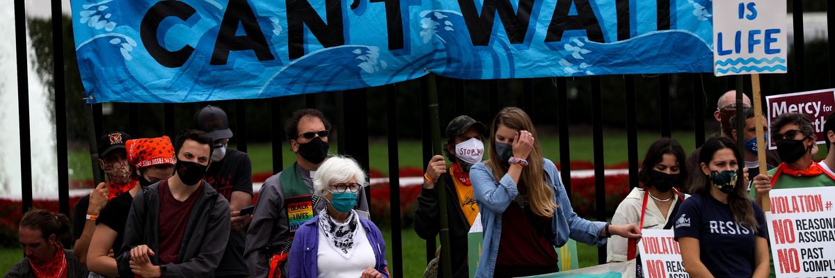 Environmentalists protest outside the White House