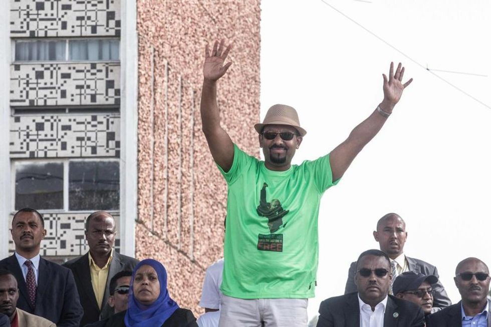 Ethiopia Prime Minister Abiy Ahmed waves to the crowd during a rally on Meskel Square in Addis Ababa on June 23, 2018. A blast at a rally in Ethiopia's capital today in support of new Prime Minister Abiy Ahmed killed several people, state media quoted the premier as saying. / AFP PHOTO / YONAS TADESEYONAS TADESE/AFP/Getty Images