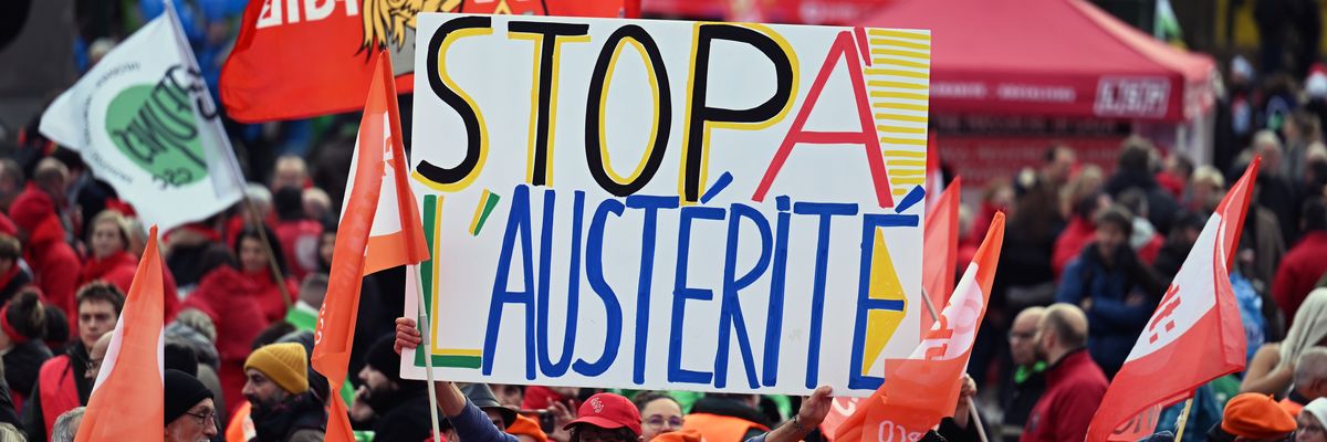 European Trade Union Confederation members hold banners at a demonstration
