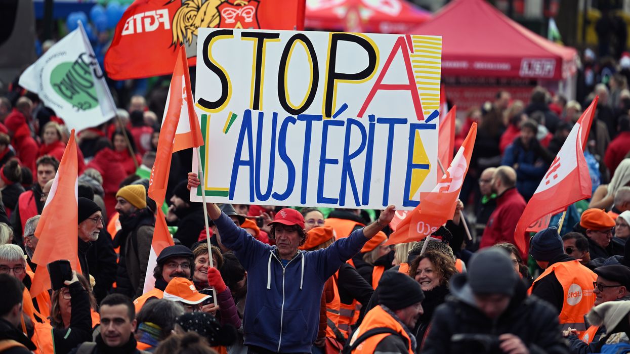 European Trade Union Confederation members hold banners at a demonstration