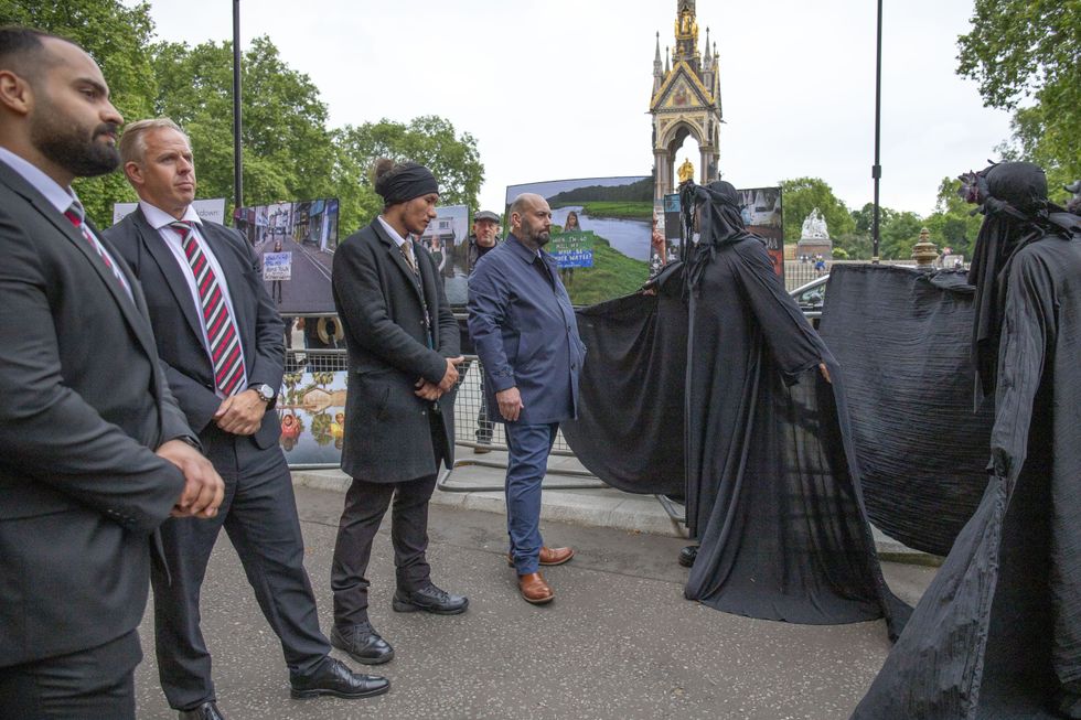 EX Oil Slicker dances around insurance industry workers.