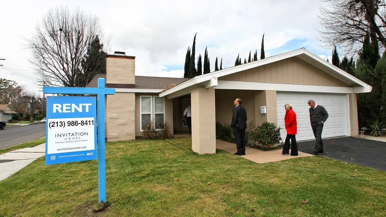 Executives of Invitation Homes, a subsidiary of the hedge fund Blackstone, tour a home