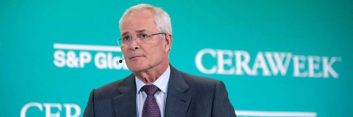 Exxon CEO Darren Woods speaks at an international energy conference 