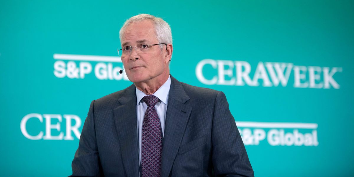 Exxon CEO Darren Woods speaks at an international energy conference