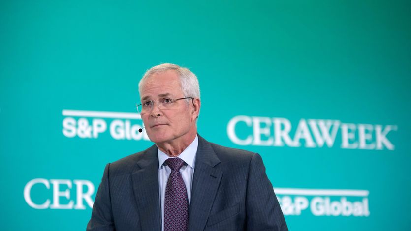 Exxon CEO Darren Woods speaks at an international energy conference