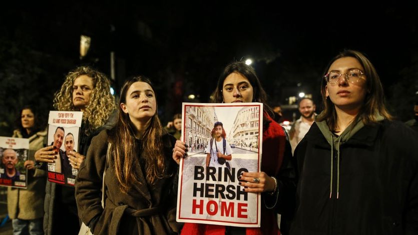 Families of Israeli hostages carry photos and banners marching to Netanyahu's residence