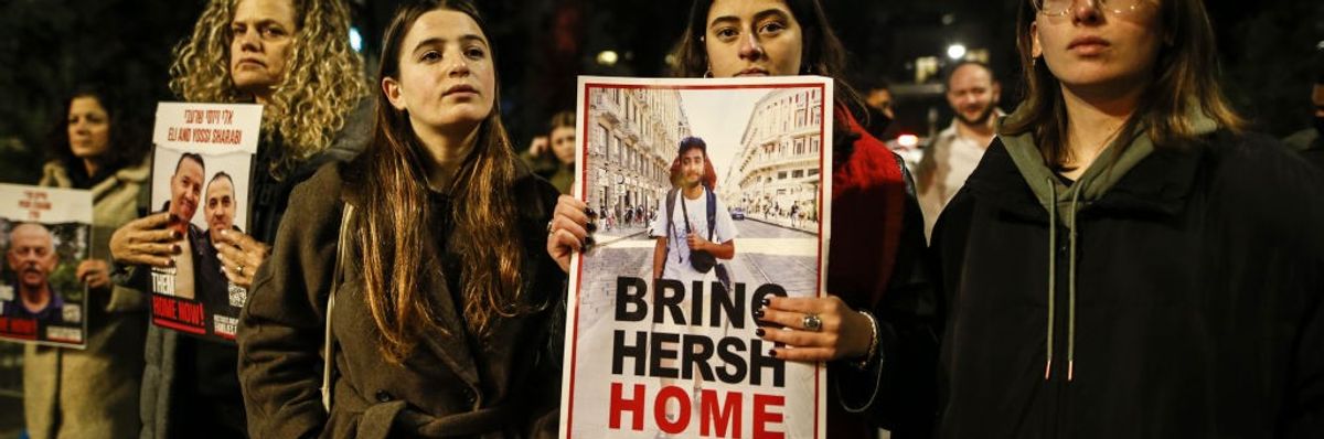 Families of Israeli hostages carry photos and banners marching to Netanyahu's residence