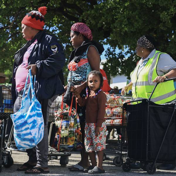 Families receive groceries from a food bank
