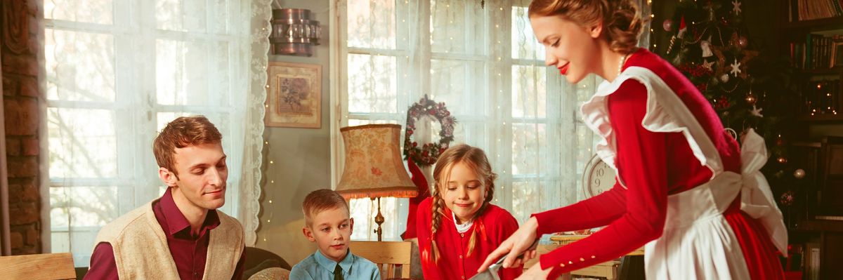Family having a holiday dinner together, 50s retro style