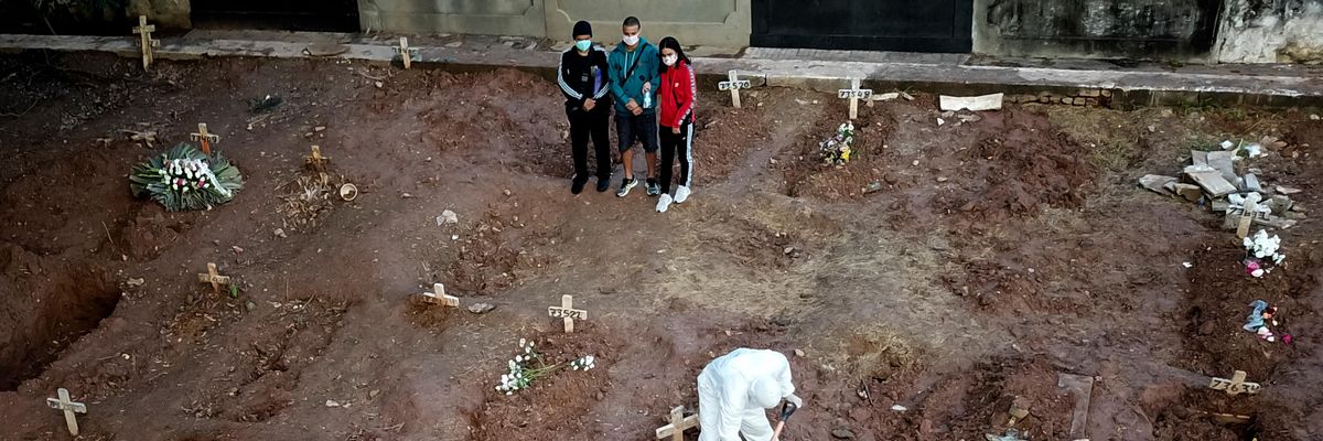 Family members mourn a loved one who died of Covid-19