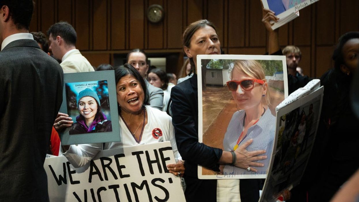 Family members of crash victims demonstrate as Boeing CEO Dave Calhoun testifies