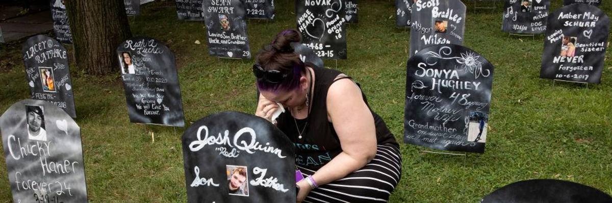 Family members of people who have died from overdosing on opioids mark International Overdose Awareness Day