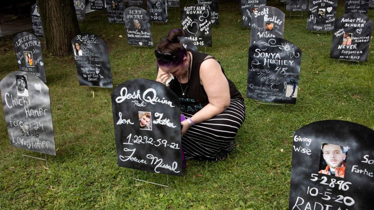 Family members of people who have died from overdosing on opioids mark International Overdose Awareness Day