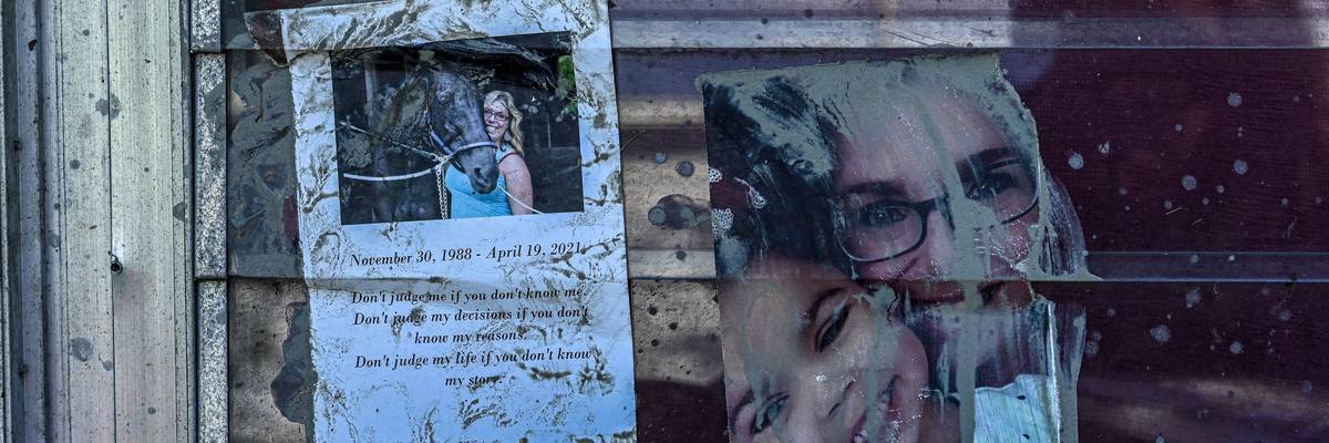 Family photos are seen taped to a window at a home in the aftermath of Hurricane Ian in San Carlos Island, Florida on October 1, 2022.