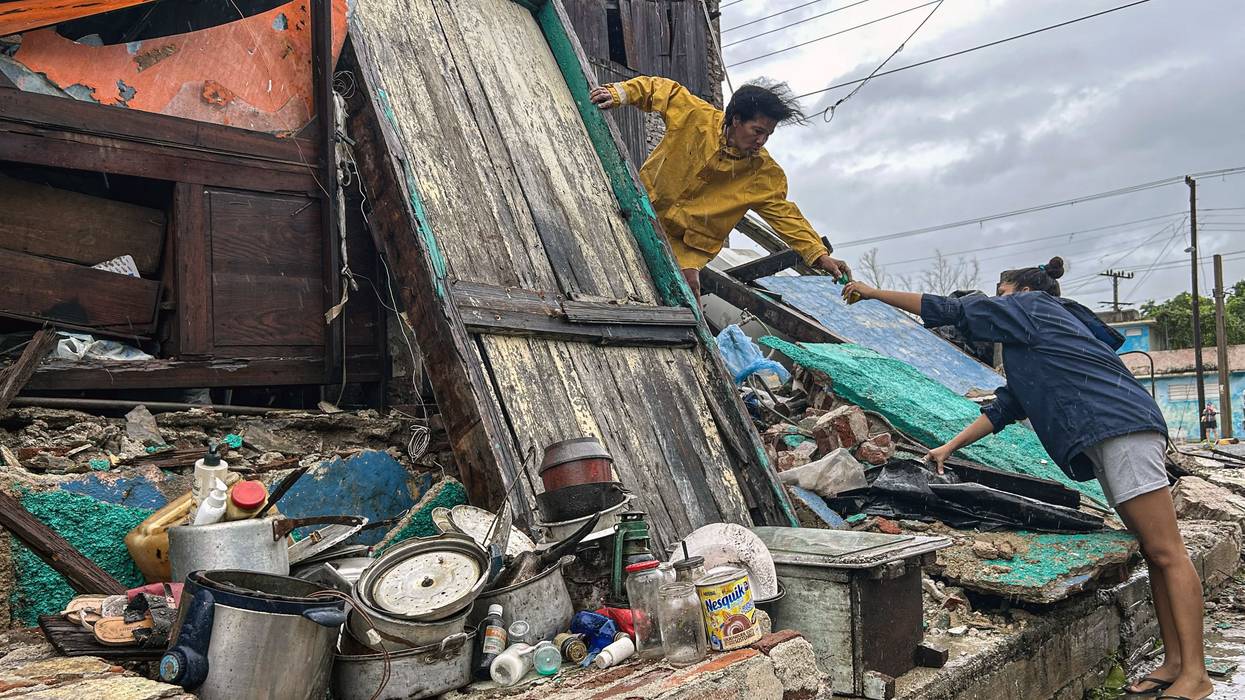 Family salvages belongings amid Hurricane Melissa