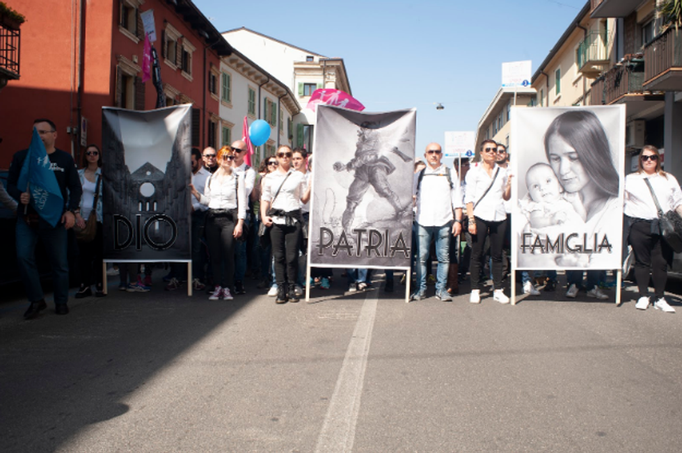 Far-right protestors with placards quoting