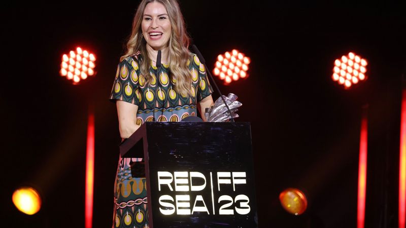 Farah Nabulsi speaks while holding award.