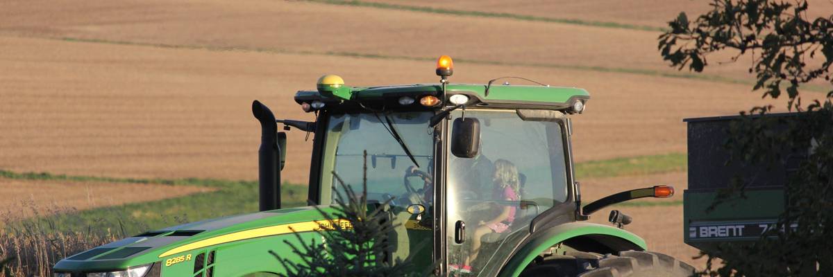 Farmer in Deere tractor