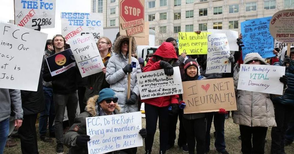 FCC commissioners Jessica Rosenworcel and Mignon Clyburn joined protesters outside the panel's headquarters on Thursday before issuing a dissent to Republican chair Ajit Pai's proposal to end net neutrality protections. The repeal was passed with a 3-2 vote. (Photo: Free Press/Flickr/cc)