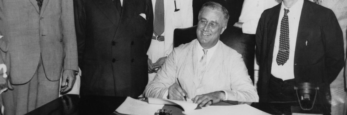 FDR signs Social Security Act