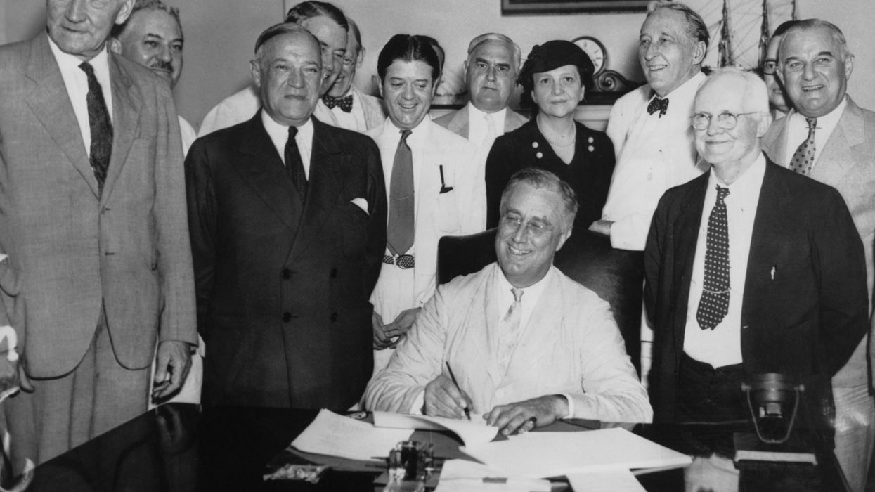 FDR signs Social Security Act