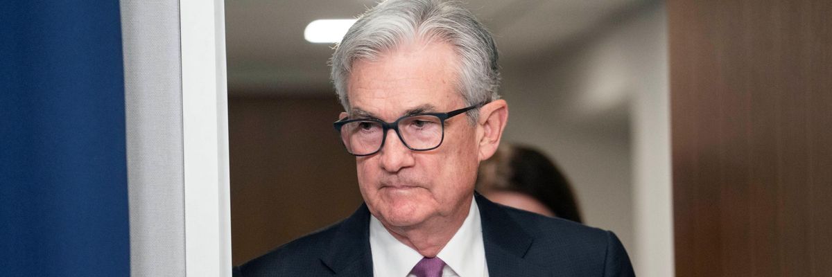 Fed chair Jerome Powell walks to a press conference