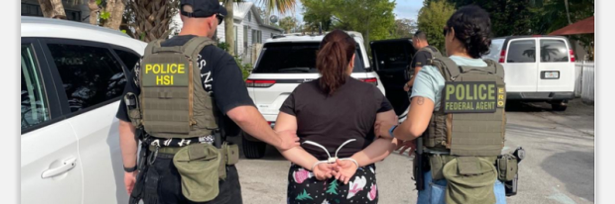 Federal police lead away a Chicago woman for our "national security"